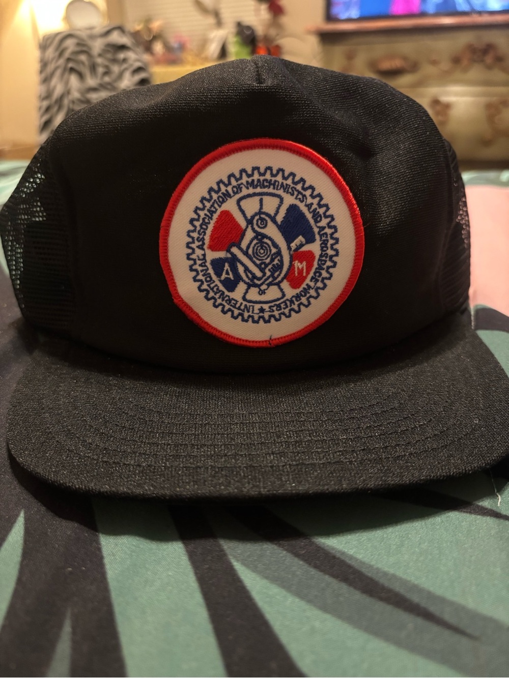Black Trucker Cap with Red & Blue Patch